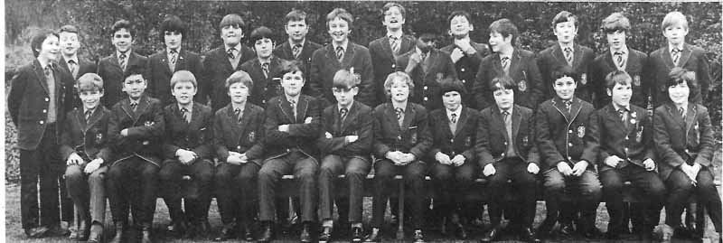 Class Photo 4 1973.jpg - Simon Walton thinks it is Primary 7 class – at the end of the academic year 1972-3Standing, third from left, Ernest DiRollo; standing ten from left (right hand raised in a fist) Niraj Varma; Seated, first on left, ME! I think; seated second left, Chi Fi Chan; seated sixth left (glasses) Peter Rica.Can you fill in the missing names?